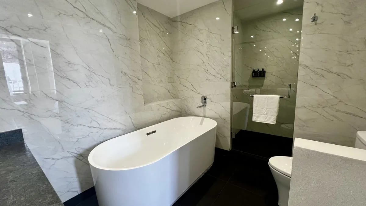 Hotel Catedral. Terrace suite with bathtub. Bathroom with luxury shower and deep soaking tub.